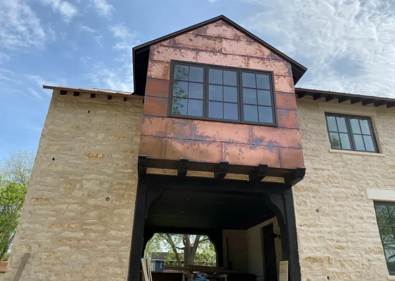 Copper metal panel facade on a stone building for Skylight Installation in Beaverton