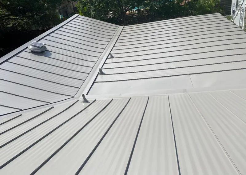Solar attic fan installed on a metal roof for Roof Ventilation in Beaverton